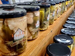 Jars of Pickle Cottage products on display.