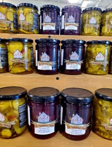 Jars of Old Fashioned Beets on a shelf with other Pickle Cottage products.
